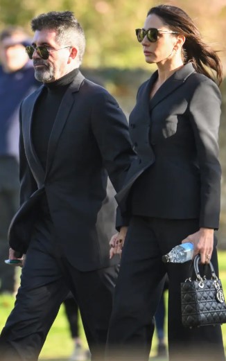 Simon Cowell attended the funeral with his fiancé.