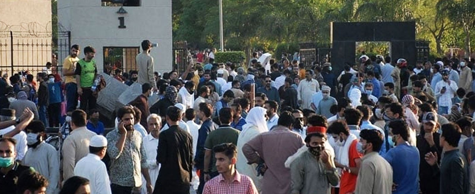 Charged mob gathers in front of the main entrance of General Headquarters (GHQ) during a protest against the arrest of PTI founder Imran Khan, in Rawalpindi on May 9, 2023. — AFP