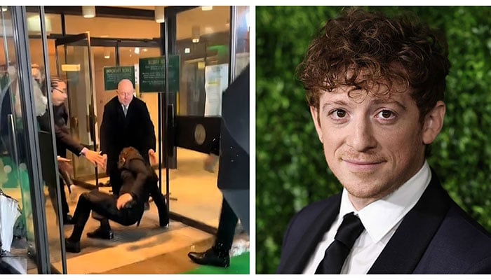 Ethan Slater takes a tumble at Wicked UK premiere.