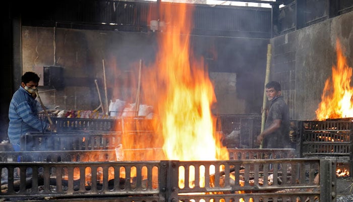 Funeral pyres of people are pictured at a crematorium in Ahmedabad, India, April 22, 2021. — Reuters