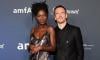 Jodie Turner-Smith dazzles in bold slip dress with Michael Fassbender at amfAR Las Vegas