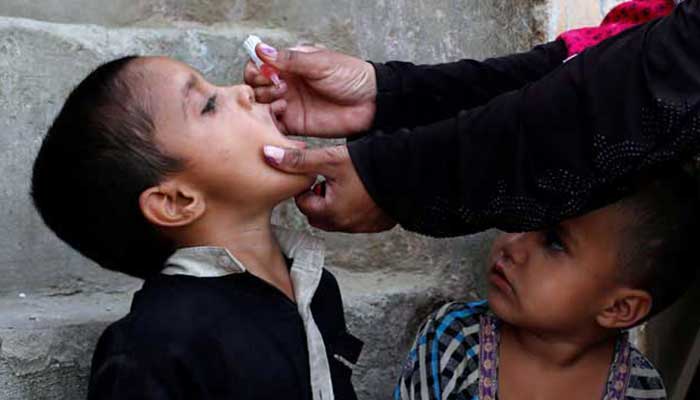 A boy receives polio vaccine drops, during an anti-polio campaign in Karachi. — Reuters/File