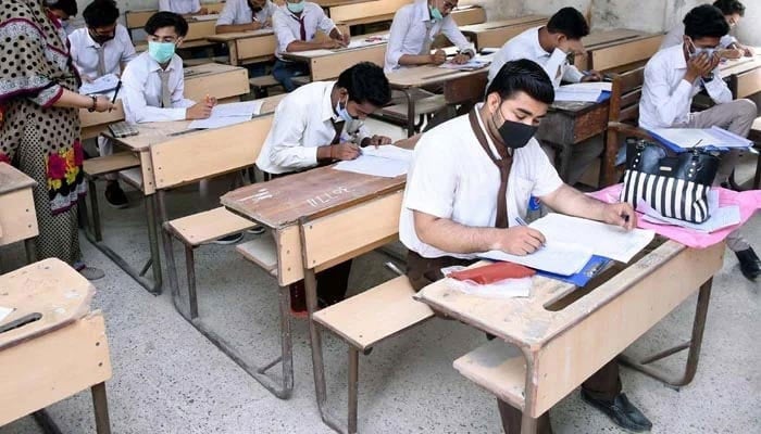 An undated photograph of students taking an exam. -AFP