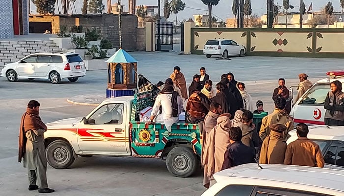 Relatives transport a body of a victim who was killed in clashes in Kurram district in Parachinar, November 22, 2024. — AFP