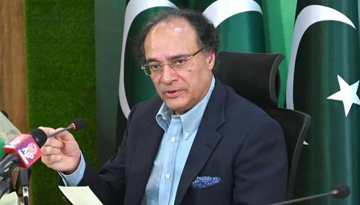 Federal Minister for Finance and Revenue Senator Muhammad Aurangzeb addressing media persons at PTV Headquarters.— APP/File