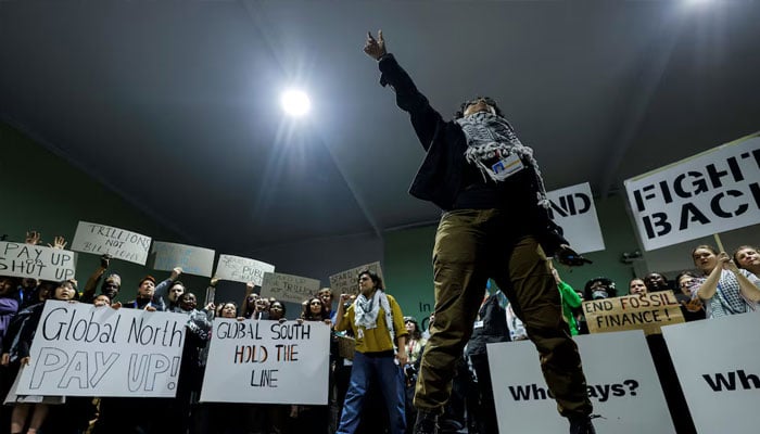 Activists shout slogans during a protest action at the COP29 United Nations climate change conference, in Baku, Azerbaijan November 23, 2024. — Reuters