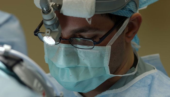 A representational image depicting a doctor performing a surgery in a hospitals operation room. — Unsplash/File