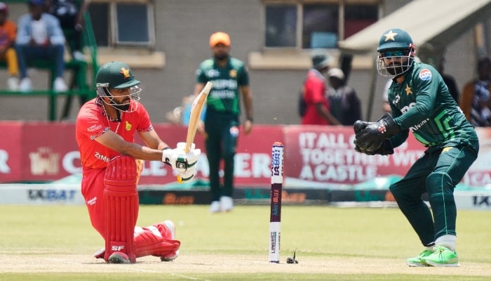 Zimbabwes Sikandar Raza (left) plays a sweep during an ODI match between Zimbabwe and Pakistan at Queens Sports Club in Bulawayo. —AFP/ File