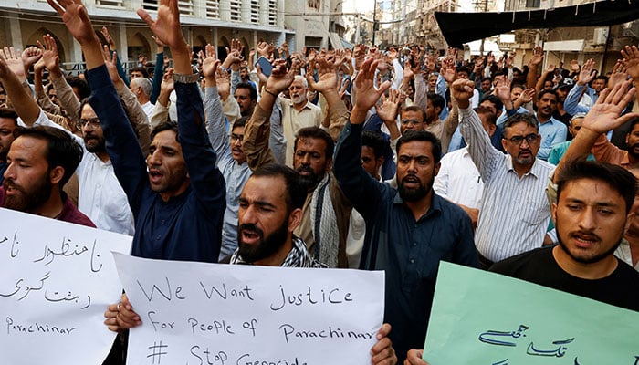 Supporters of Majlis-e-Wahdat-e-Muslimeen hold placards as they chant slogans to condemn the killings of people, after gunmen opened fire on passenger vehicles in the Kurram tribal district, during a protest in Karachi, November 22, 2024. — Reuters