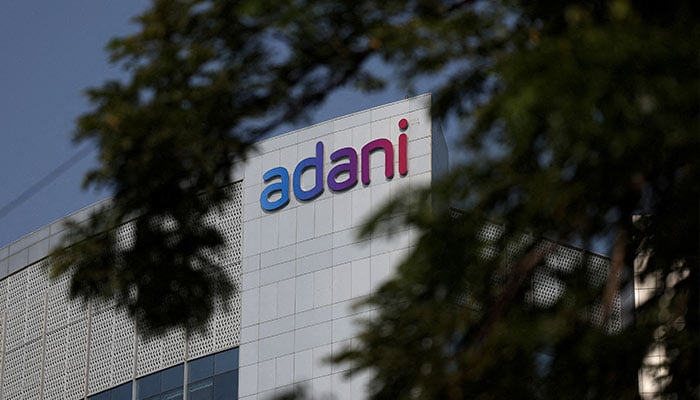 The logo of the Adani Group is seen on the facade of its Corporate House on the outskirts of Ahmedabad, India, November 21, 2024. — Reuters