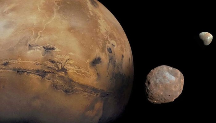 Image shows Mars and its moons Phobos and Deimos. — Nasa website/File