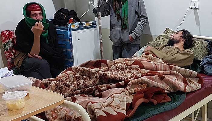 An injured victim is treated at a hospital after he was wounded in attacks in Kurram district in Parachinar, November 27, 2024. — AFP