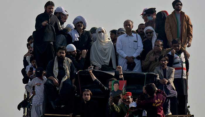 Bushra Bibi, wife of jailed former prime minister Imran Khan, and supporters of Khans party Pakistan Tehreek-e-Insaf (PTI) attend a rally demanding his release, in Islamabad, November 26, 2024. — Reuters