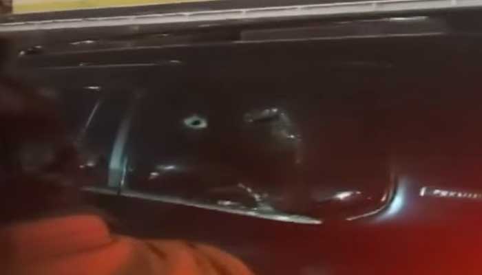 An image showing damaged window of a vehicle after being pelted by stone during PTIs protest in Islamabad. — Screengrab via Geo News