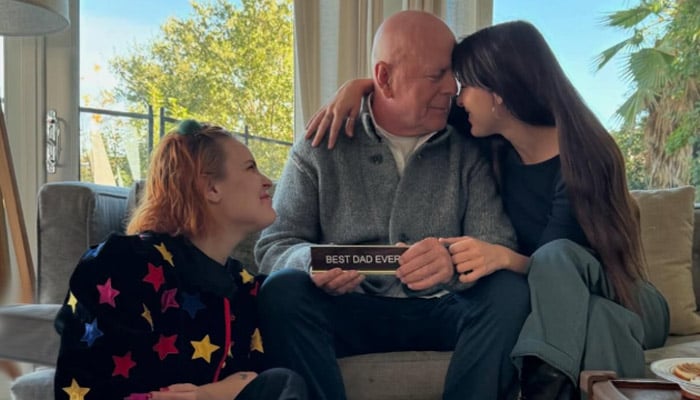 Bruce Willis poses with his daughters, Tallulah and Scout, whom he shares with ex-wife Demi Moore