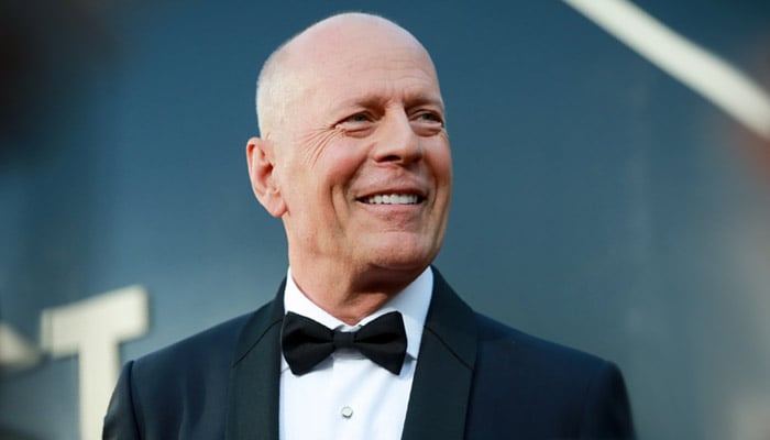 Bruce Willis poses with his daughters, Tallulah and Scout, whom he shares with ex-wife Demi Moore