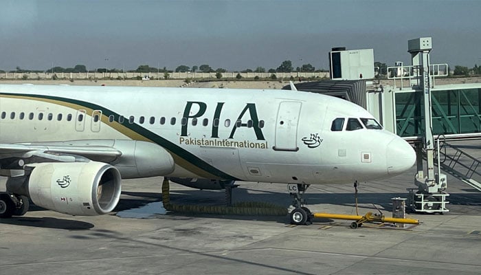 This file photo shows a Pakistan International Airlines plane at an airport.— Reuters