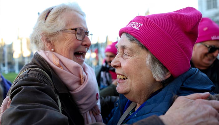 Women hug each other during a demonstration in support of assisted dying outside the British parliament after lawmakers voted in favour of the assisted dying law, in London, Britain, November 29, 2024. — Reuters