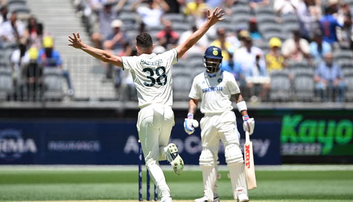 Australias Josh Hazlewood celebrates after taking the wicket of Indias Virat Kohli on November 22, 2024. — Reuters