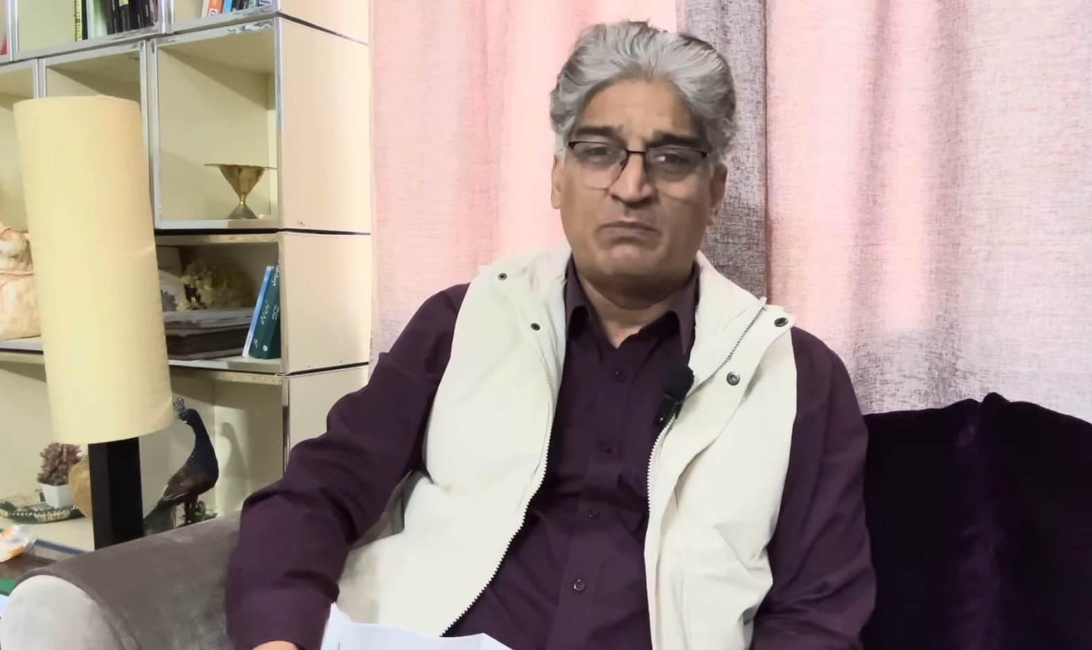 Senior journalist Matiullah Jan gestures during a video at his office in Islamabad on November 24, 2024. — Screengrab/ YouTube/ @MatiullahJanMJtv