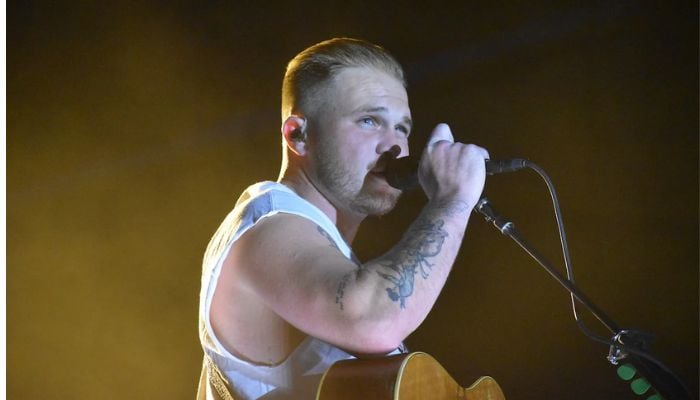 Zach Bryan got hit by a hard object while singing on stage.