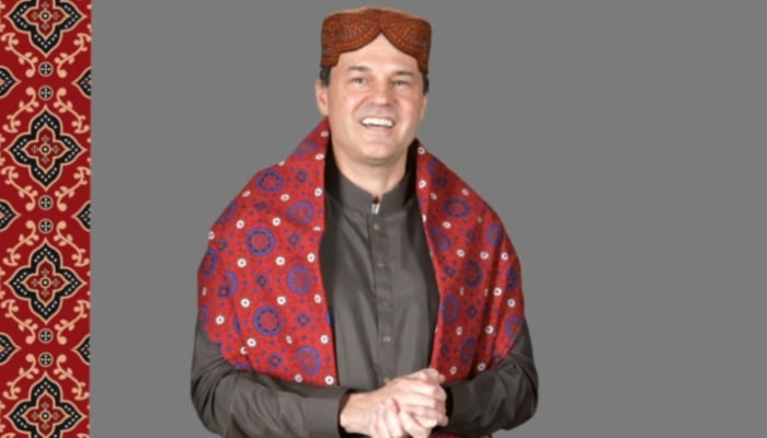 US Consul General in Karachi Scott Urbom wearing Sindhi Ajrak and a cap on December 1, 2024. — Screengrab/ Facebook/ @karachi.usconsulate