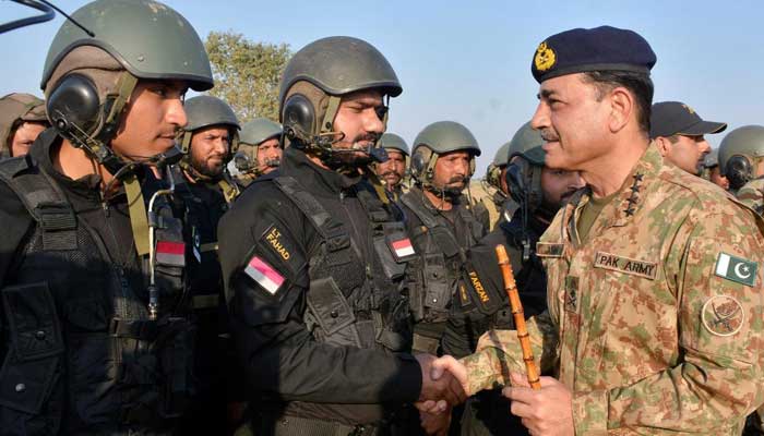 COAS General Asim Munir interacts with soldiers during his visit of a field training exercise near Narowal and Sialkot in this image released on December 3, 2024. — ISPR