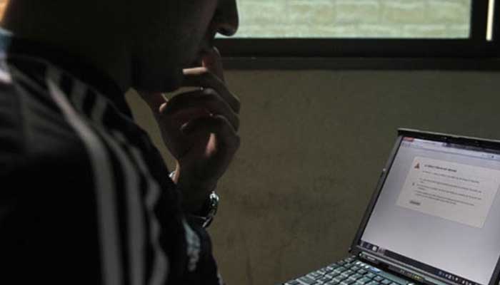 A representational image showing a person using a laptop. — AFP/File