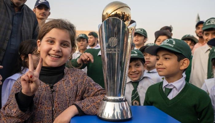 School kids posing with ICC Champions Trophy trophy on November 18, 2024. —Facebook/ @PakistanCricketBoard