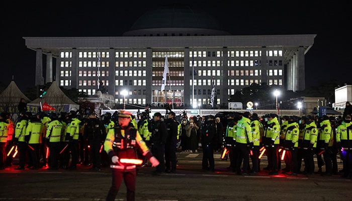 Police officers gather outside the National Assembly, after South Korean President Yoon Suk Yeol declared martial law, in Seoul, South Korea, December 4, 2024. — Reuters