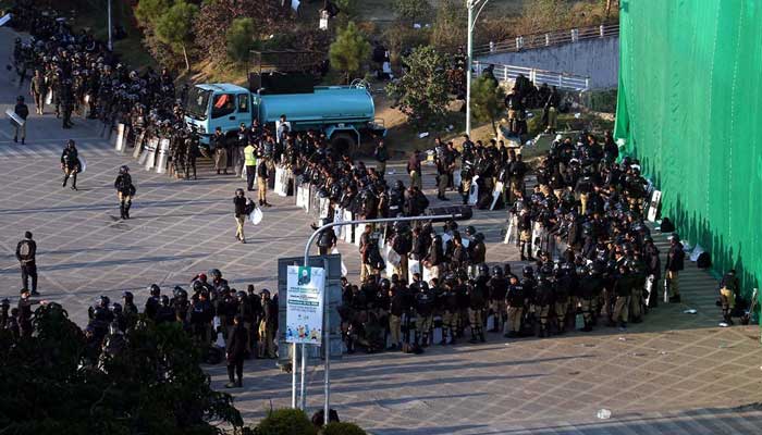 A view of large number of police personal stand near container at D-Chowk due to PTI protest in twin cites on November 25, 2024. — INP