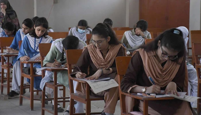 Students solving papers during the annual exam of SSC Part-I at the examination centre, in Karachi on May 8, 2023. — Online