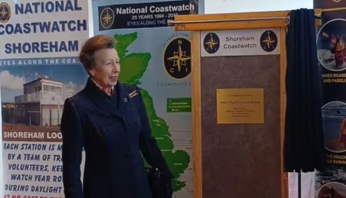 Princess Anne makes light of wet weather.