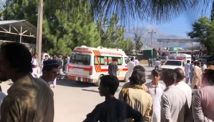 An ambulance is parked while people have gathered around it in Kurram. —Reporter/ File