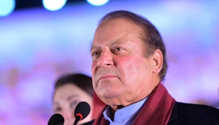 Nawaz Sharif looks at his supporters gathered at Minar-e-Pakistan during an event held to welcome him in Lahore on October 21, 2023. — X @pmln_org