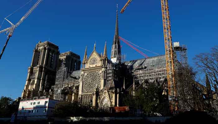 Cranes are seen around the Notre-Dame de Paris Cathedral in France on October 23, 2024. — Reuters