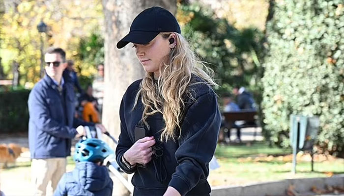 Amber Heard radiates as she steps out in Madrid for first time.