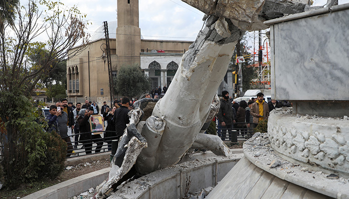 People gather at Saadallah al-Jabiri Square as they celebrate, after Syrias army command notified officers on Sunday that President Bashar al-Assads 24-year authoritarian rule has ended. — Reuters