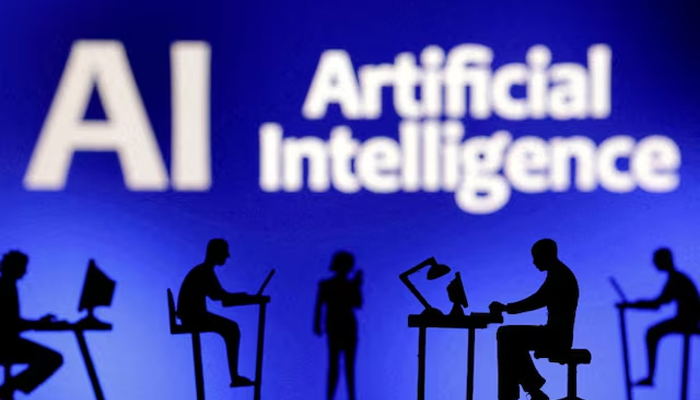 Figurines with computers and smartphones are seen in front of the words Artificial Intelligence AI in this illustration taken, February 19, 2024. — Reuters