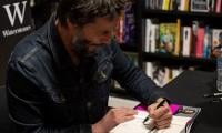 Keanu Reeves Signs Books, Not Just Autographs