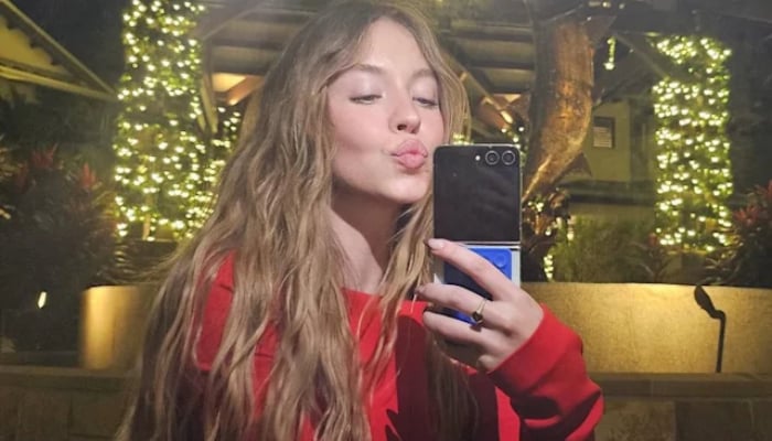 Sydney Sweeney heats up Christmas season with red mini dress