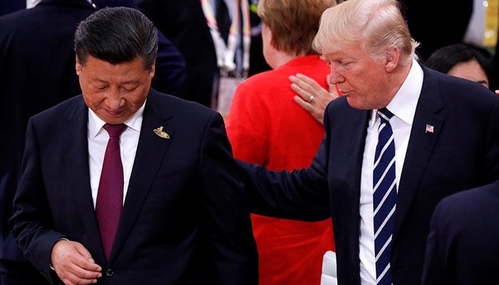 US President-elect Donald Trump talks to Chinas President Xi Jinping during the G20 leaders summit in Hamburg, Germany July 7, 2017. — Reuters