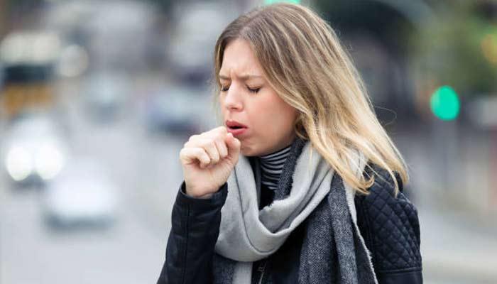 A representational image shows a person coughing. — Pexels