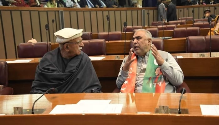 PkMAP Chairman Mahmood Khan Achakzai (left) with PTI leader Asad Qaiser in the National Assembly, Islamabad. —Facebook/ @MasherOfficial/ File