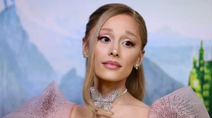 Ariana Grande displays on robust moments from ‘Wicked’ shoot