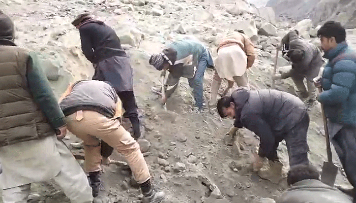 Local people are busy in rescue efforts to retrieve bodies of victims buried due to a landslide in Skardu on December 15, 2024. — Reporter