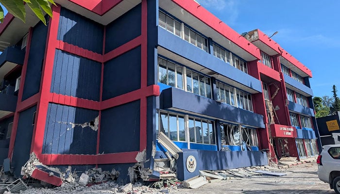 A general view of a severely damaged building housing the embassies of the United States, United Kingdom, and New Zealand after a powerful earthquake struck Port Vila, the capital city of Vanuatu, on December 17, 2024. — AFP