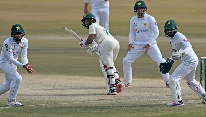 Picture taken during the 2nd Test between South Africa and Pakistan at the Rawalpindi Cricket Stadium shows Temba Bavuma playing a shot as home sides fielders look on, on February 8, 2021. — AFP