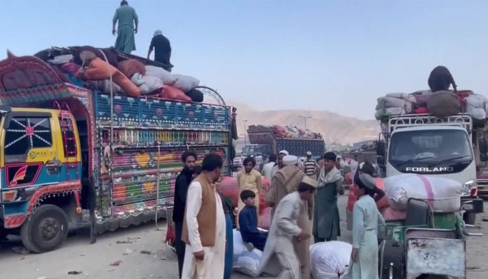 A representational image depicting men loading their belongings on a bus. — Reuters/File