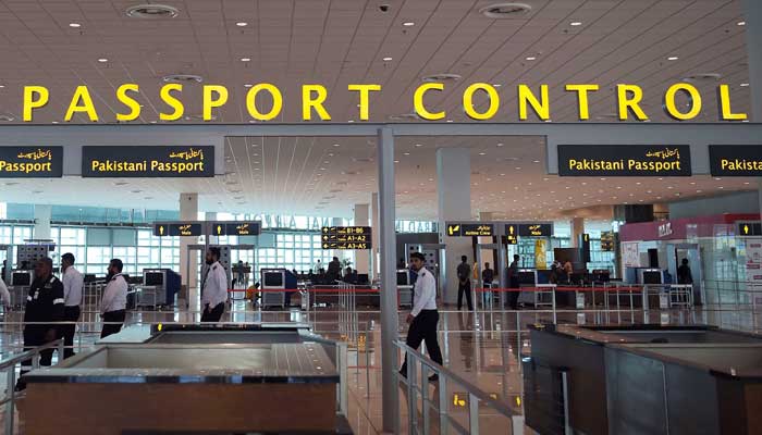 Airport staff walk through security at the new Islamabad International Airport. — AFP/File